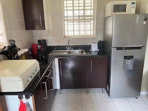 Fridge, microwave, coffee/tea maker, toaster
