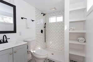 Bathtub, hair dryer, towels