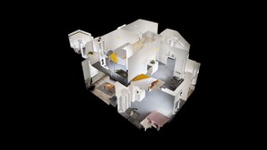 A 3D architectural model of a hotel room with a bed, bedside table, and a small seating area. - City Centre-university Home From Home (Sunderland)