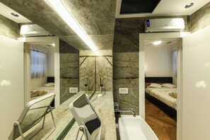 Shower, hair dryer, towels, toilet paper