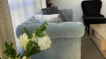 Classic Townhome | Living area | 24-inch LED TV with digital channels, pay movies