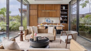 PreZidential Villa | Living area | 55-inch LED TV with satellite channels, books