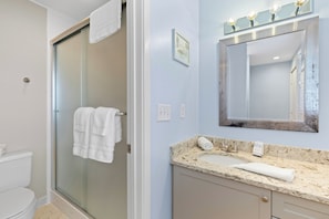 Bathtub, hair dryer, towels, soap