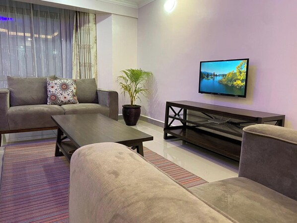 43-inch flat-screen TV with digital channels - Midtown B61 Apartment (Nakuru)