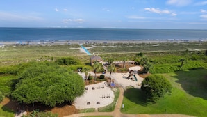 A beach park with a playground, walking paths, and a view of the ocean. - Surfside Hideaway (Hilton Head Island)