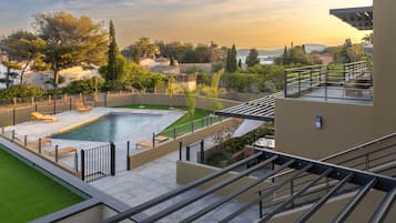 Seasonal outdoor pool, open 8:00 AM to 8:00 PM, pool umbrellas