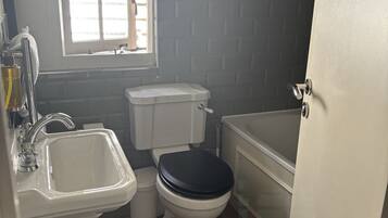 Shower, rainfall showerhead, hair dryer, towels