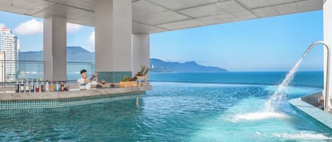 Indoor pool, open 7:00 AM to 9:00 PM, pool umbrellas, sun loungers