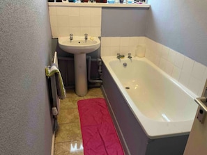Shower, hair dryer, towels, toilet paper