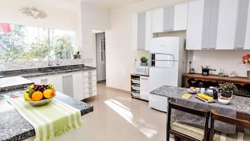 Villa | Private kitchen | Fridge, microwave, oven, stovetop