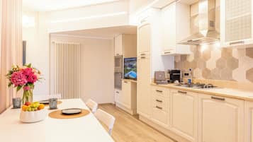 Junior Suite 141 | Living area | 42-inch LED TV with satellite channels