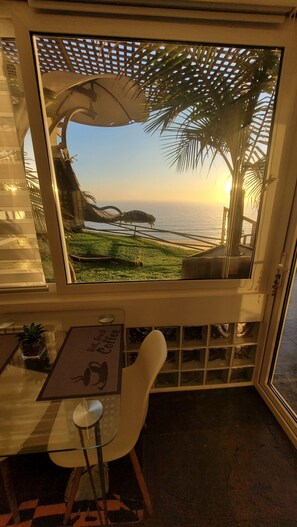 Deluxe Apartment, Ocean View | Living area | 42-inch Smart TV with cable channels, Hulu, streaming services