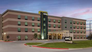 Welcome to HOME 2, a Hilton hotel with a multi-story structure and covered entrance.