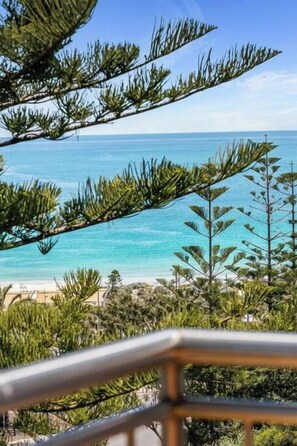 A coastal view with a clear sky, a beach, and dense greenery. - Apartment M401 - coastal style and luxury awaits! (Scarborough)