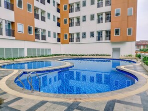 Outdoor pool - Comfort And Serene 2Br At Urban Heights Apartment (South Tangerang)