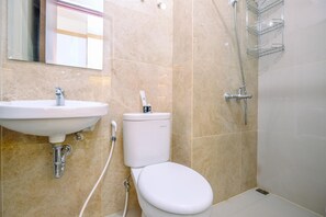Studio | Bathroom | Shower, free toiletries, towels - Cozy Stay And New Furnished Studio At Transpark Cibubur Apartment (Depok)