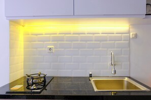 Studio | Private kitchen | Full-sized fridge, stovetop - Best Deal Studio At Grand Asia Afrika Apartment (Bandung)