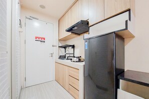 Studio | Private kitchen | Full-sized fridge, stovetop - Cozy And Simply Studio Apartment At Urban Heights Residences (South Tangerang)