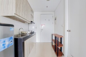 Studio | Private kitchen | Full-size fridge, stovetop - Fancy And Nice Studio Apartment At Tuscany Residence (South Tangerang)