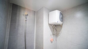 Studio | Bathroom | Shower, free toiletries, towels - Tidy And Clean Studio At Taman Melati Surabaya Apartment (Surabaya)
