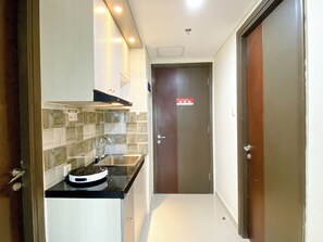 Apartment | Private kitchen | Full-sized fridge, stovetop - Cozy And Comfort 2Br At Pollux Chadstone Apartment (Cikarang)