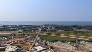 An aerial view of a coastal area with buildings, roads, and a body of water. - Best Deal And Comfort Studio Tokyo Riverside Pik 2 Apartment (Teluknaga)