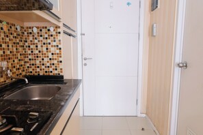 Studio | Private kitchen | Full-sized fridge, stovetop - Good Deal Studio Apartment At Parahyangan Residence (Bandung)