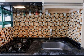 Studio | Private kitchen | Full-sized fridge, stovetop - Good Deal Studio Apartment At Parahyangan Residence (Bandung)