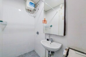 Studio | Bathroom - Minimalist And Warm Studio Room (No Kitchen) Kubikahomy Apartment (Pagedangan)