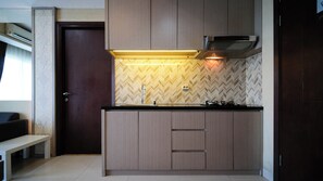 Private kitchen - Modern And Cozy 1Br At Grand Sungkono Lagoon Apartment (Surabaya)