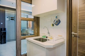 Apartment | Private kitchen | Full-size fridge, microwave, stovetop, rice cooker
