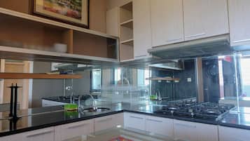 Apartment | Private kitchen | Full-size fridge, stovetop
