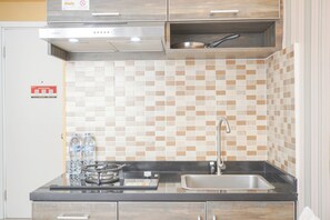 Studio | Private kitchen | Full-sized fridge, stovetop - Cozy Stay Studio At Green Pramuka City Apartment (Jakarta)