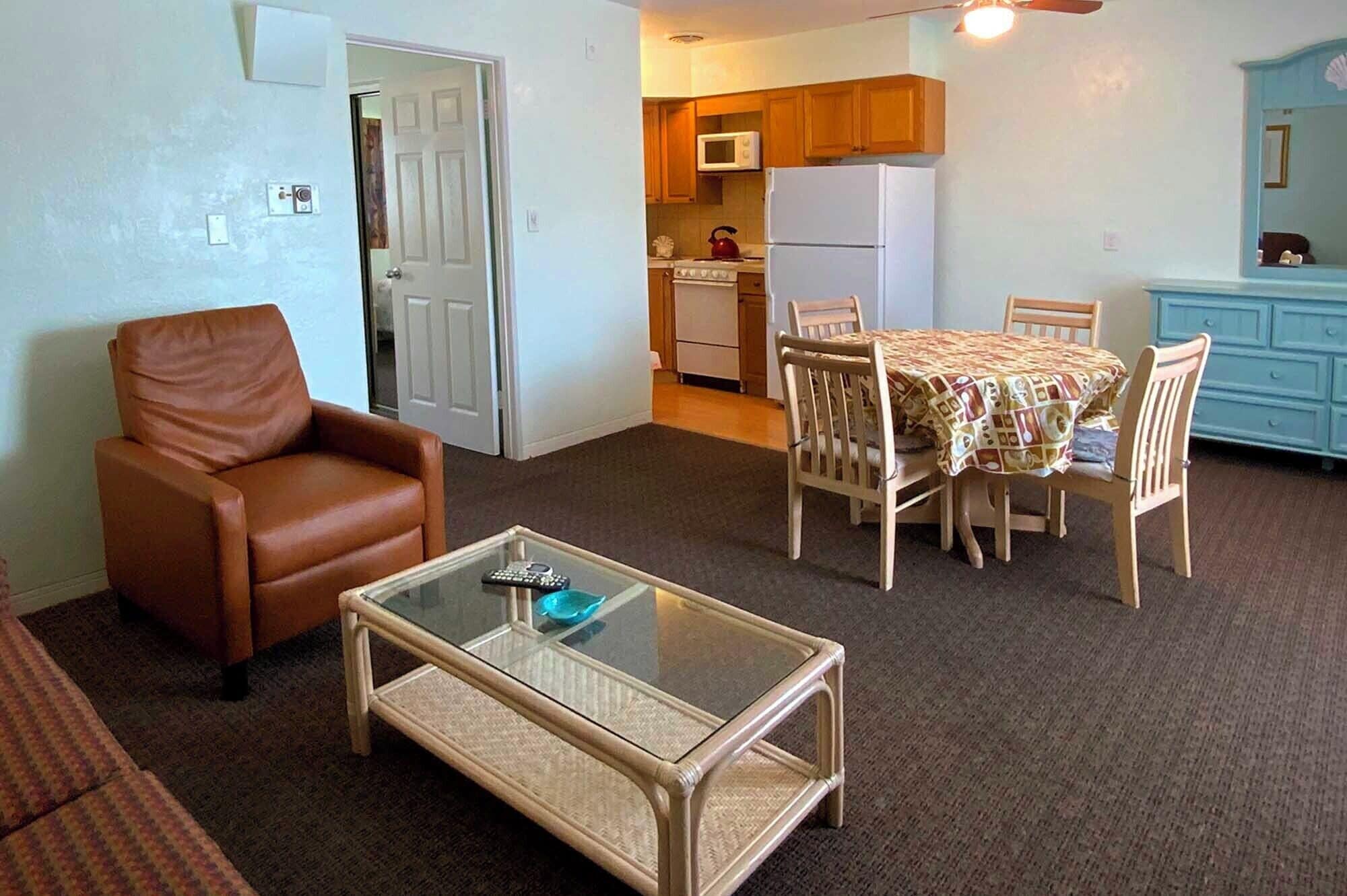 Deluxe Apartment, 2 Double Beds, Courtyard Area | Living area | 42-inch TV with cable channels