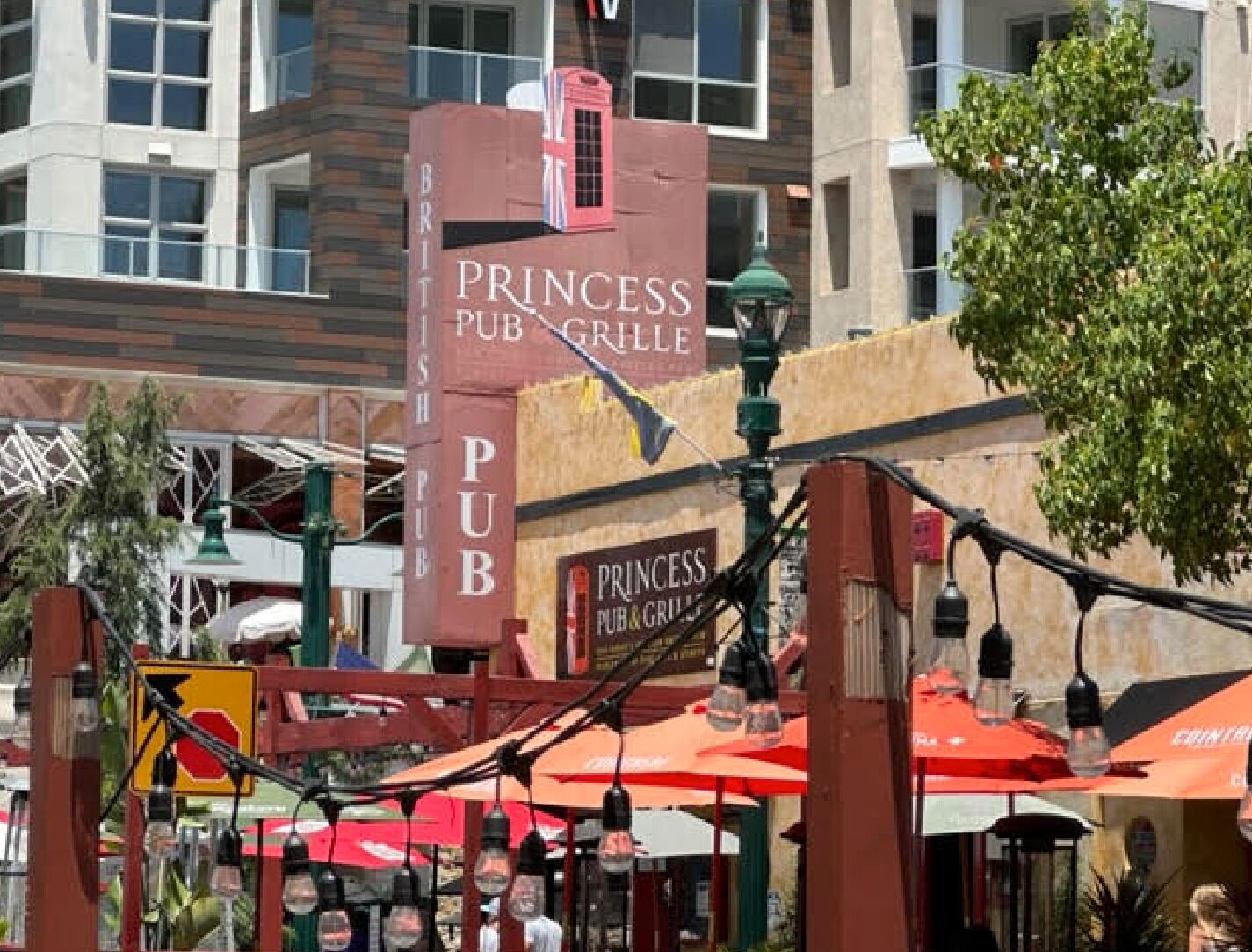 A Princess Pub Grill with outdoor seating and a prominent sign.