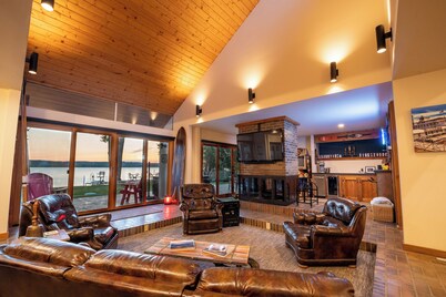 Unique riverfront home w/ beach, dock, watersports, firepit, hot tub, and sauna!