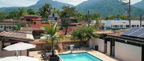 Outdoor pool, open 8:00 AM to 10:00 PM, pool umbrellas, sun loungers