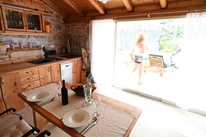 Fridge, stovetop, dishwasher, coffee/tea maker