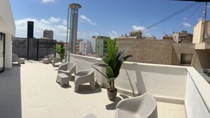 A rooftop terrace with modern outdoor seating and potted plants. - Perfect, Modern Studio In The Heart Of Alicante (Alicante (Alacant))