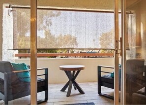 Enjoy a tranquil retreat with a balcony offering a view of the surrounding neighborhood.