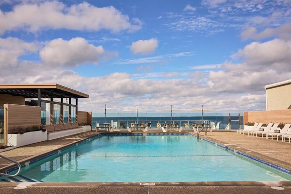 Dive into the sparkling pool with sweeping ocean views.