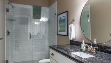 Shower, hair dryer, towels, toilet paper