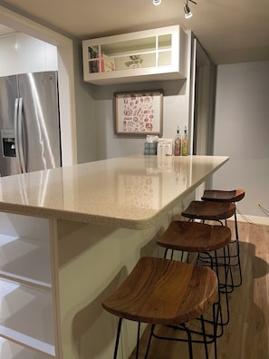 Stovetop, toaster, dining tables