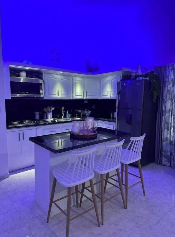 Fridge, microwave, stovetop, coffee/tea maker