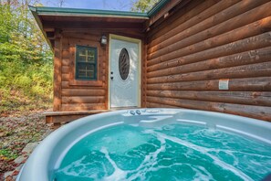 A wooden cabin with a hot tub in front. - Creekside Serenity | Hocking Hills, Creek, Hot Tub (Logan)
