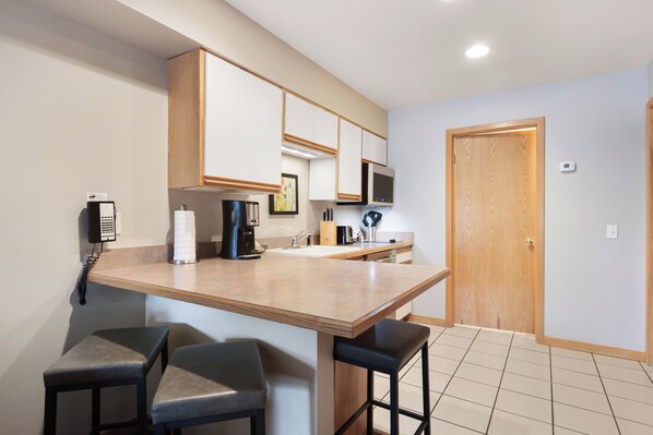 Fridge, microwave, stovetop, coffee/tea maker
