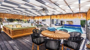 An outdoor deck with a pool, wooden furniture, and a ceiling with a geometric pattern. - Stunning!! - Casa Chameleon - Sleeps 14 - Close to Quinta Do Lago & Vale Do Lobo (Faro)
