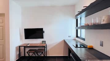 Deluxe kamer | Een kluis op de kamer, beddengoed