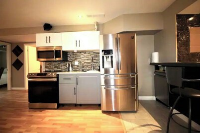 Classy & comfy lower level suite w fireplace/yard.
