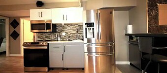 Classy & comfy lower level suite w fireplace/yard.